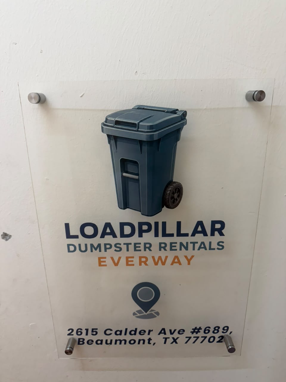 Clear acrylic office sign for Loadpillar Dumpster Rentals Everway at 2615 Calder Ave #689, Beaumont, TX 77702